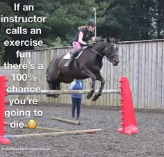 a girl riding on the back of a brown horse over an obstacle with words above it