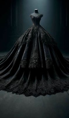 a black dress on display in a dark room