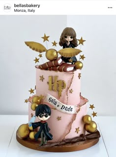 a pink and gold birthday cake with harry potter figurines on the top tier