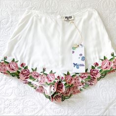 These Stunning New With Tags Show Me Your Mumu Ashton Shorts Won’t Last For Long! Perfect For The Summer. Airy And Lightweight. Shorts Are Lined. Size Small And Fits True To Size. Retails For $106; Don’t Miss This Deal! Scalloped Rose Embroidery Edges These Shorts Cut With A High Waist That Complements All Your Cropped Pieces. Hidden Back-Zip Closure. I Ship Everything Same Or Next Business Day! Fabric Content: 100% Rayon Waist: 27" Hip: 38" Rise: 12" Inseam: 2" Fitted Floral Embroidered Bottoms For Summer, Fitted Floral Embroidery Bottoms For Summer, White Cotton Bottoms With Embroidered Hem, Summer Cotton Shorts With Floral Embroidery, Floral Embroidery Shorts For Summer Vacation, Floral Embroidered Cotton Summer Shorts, White Floral Embroidery Bottoms For Spring, White Embroidered Summer Shorts, White Cotton Shorts With Floral Embroidery