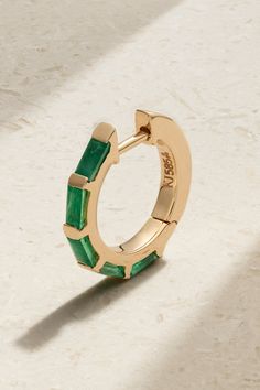 KOLOURS JEWELRY's founder Magnus Thorud is dedicated to designing pieces that allow you to express your individuality. This hoop earring is cast from 14-karat gold and set with stunning emeralds. Wear it alongside the sapphire and topaz versions in our edit. Modern Small Hoop Jewelry With Prong Setting, 14k Gold Huggie Jewelry With Gemstones, Yellow Gold Emerald Huggie Earrings, Emerald Huggie Earrings For Anniversary, 14k Gold Gemstone Huggie Earrings, Fine Jewelry Emerald Hoop Earrings, Fine Jewelry Emerald Huggie Earrings, Luxury Gemstone Huggie Jewelry, Yellow Gold Gemstone Hoop Jewelry