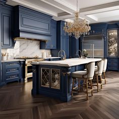 a large kitchen with blue cabinets and marble counter tops, an island in the middle