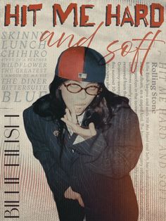 a woman wearing glasses and a baseball cap with her hand on her chin, standing in front of a newspaper advertisement