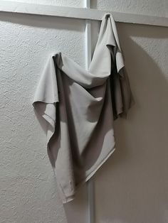 a folded piece of cloth hanging on the wall