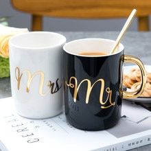 two coffee mugs with the word mr and mrs on them sitting next to each other