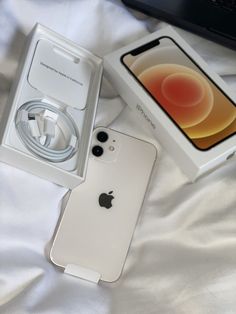 an apple iphone in its box on a bed