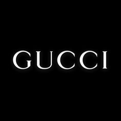 the word gucci is lit up against a black background with white letters on it