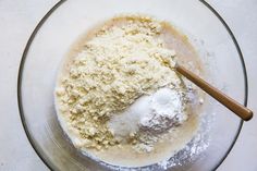 a bowl filled with dry ingredients on top of a table