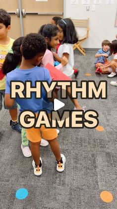 children are playing with different colored circles on the floor in front of an advertisement that says rhythm games