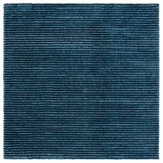 a blue rug with horizontal stripes on the bottom, and an area that has been made from