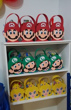 mario brothers party favors and decorations on a shelf in a kids's birthday party