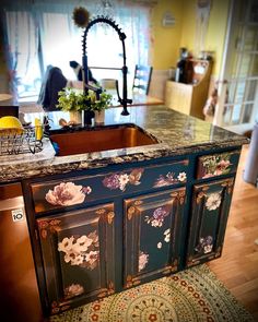 a kitchen with an island and sink in it