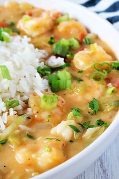 a white bowl filled with shrimp and rice