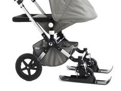 a stroller with a baby in it on a white background