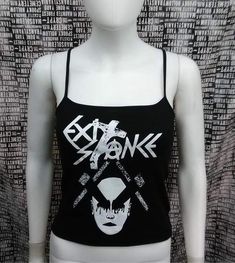 This is a black Exit-Stance crop tank top with spaghetti straps. This has a Exit-Stance image screen printed on the front. 57% cotton/ 38% polyester/ 5% SpandexThese are handmade screenprinted and slightly vary from the photo. Please feel free to email me any questions. Thanks for looking.Due to an influx of incorrect addresses if a package is returned,  you must pay the shipping cost to resend the item to you.I do not do exchanges and I do not take returns unless the item is damaged. I thorough Graphic Print Tank Top For Concerts In Spring, Graphic Print Tank Top For Spring Concerts, Edgy Crop Top For Alternative Fashion, Grunge Graphic Print Tank Top For Summer, Summer Grunge Graphic Print Tank Top, Fitted Punk Tank Top With Graphic Print, Band Merch Graphic Tank Top For Spring, Spring Band Merch Tank Top With Graphic Print, Stretch Punk Crop Top For Streetwear