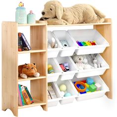 a toy dog laying on top of a book shelf filled with bins and toys