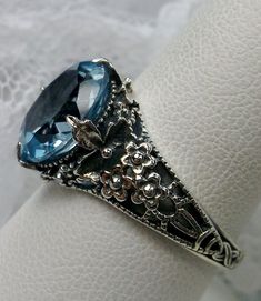 Excited to share the latest addition to my #etsy shop: 4ct Oval Natural Sky Blue Topaz Sterling Silver Victorian Floral Leaf Filigree Ring (Made To Order) Design #62 https://etsy.me/2oUxOoS #jewelry #ring #sterling #silver #no #yes #girls #blue #topaz Antique Oval Topaz Jewelry, Antique Oval Topaz Ring, Elegant Sapphire Filigree Ring In Oval Shape, Elegant Sapphire Oval Filigree Ring, Victorian Oval Topaz Jewelry, Elegant Sapphire Filigree Ring With Oval Shape, Elegant Oval Sapphire Filigree Ring, Elegant Oval Turquoise Topaz Ring, Elegant Turquoise Oval Topaz Ring