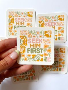 four square stickers with the words seek him first printed on them