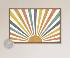 a colorful sunburst is featured in this art print on the wall above a bed