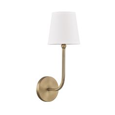 a wall light with a white shade on the side and a gold finish to it