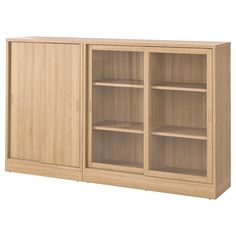 a large wooden cabinet with glass doors on the front and bottom shelves in light wood