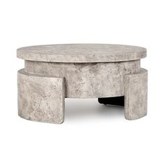 a concrete coffee table with two stools underneath it