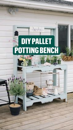 a potting bench sitting on top of a wooden deck next to a building with flowers