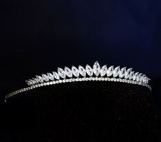 a tiara is shown on a black surface