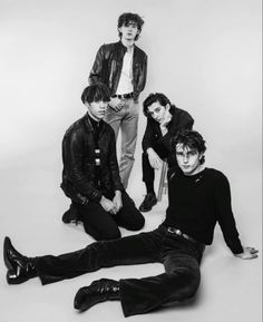 the rolling stones posing for a black and white photo in front of a white background