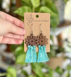 Get your free-spirit boho vibe on with these fun handmade macrame flower earrings!  These bohemian earrings were carefully hand knotted using soft recycled cotton cord on a wood flower piece. These dangle earrings are very lightweight. Makes the perfect gift for the hippie girl in your life.  Handmade with love in the USA.  *Nickel free earrings. Handmade with eco-friendly materials! I use high quality cord made from recycled cotton. Nearly all my products are made with recycled cotton or recycled polypropylene cord. I strive to be as eco-friendly as possible with all my materials and processes. ** Attention local buyers ** If you prefer to arrange for in-person pick up instead of having your item shipped to you, please message me after placing your order and I can refund any shipping cost Bohemian Flower Earrings For Beach Spring, Bohemian Spring Flower Earrings For Beach, Spring Bohemian Flower Earrings For Beach, Bohemian Macrame Tassel Earrings, Turquoise Handmade Tassel Earrings For Festivals, Handmade Turquoise Tassel Earrings For Festival, Bohemian Adjustable Macrame Tassel Earrings, Adjustable Bohemian Fringe Jewelry, Bohemian Turquoise Flower Earrings Nickel Free