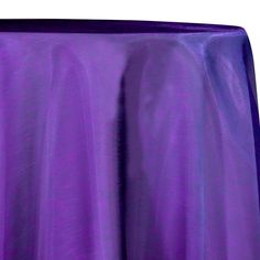 a purple table cloth on top of a round table