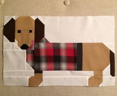 the dog is made out of fabric on the wall