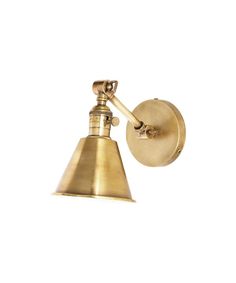 an antique brass wall light on a white background