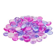 a pile of pink and purple buttons on a white background