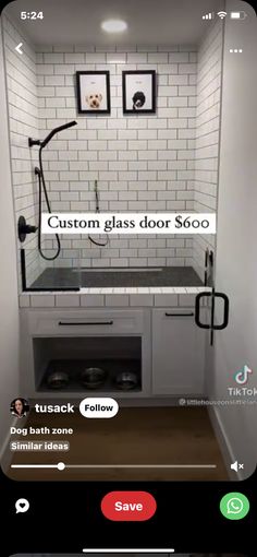 an image of a bathroom with white tile and black accents on the walls, including a shower