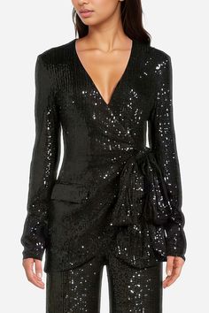 A holiday head-turner. The Frankie is a gorgeous sequin blazer or together with The Frankie Pant, an entire sequin suit made for the girly girls. This wrap top has a plunging v-neckline and long sleeves––a super flattering silhouette for all body types. The Fankie also has an elegant, ruched bow detail on the blazer's left side and a suit pocket on the right. You can finally leave your purse at home. Oh, and did we mention that our ultra-luxe stretch sequin fabric on this matching set leaves ple Sequin Suit, Black Sequin Mini Dress, Sequins Top, Calf Length Dress, Wrap Jacket, Sparkly Dress, Sequin Mini, Sequin Fabric, Dressy Tops