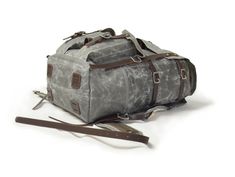 The Freefolk Bushcraft Backpack in Grey and stainless steel hardware. This bag has been handcrafted for adventures or peaceful time in the woods. You can easily fit IN and ON the bag all your gear and supplies needed for weeks in the wilderness. Made of genuine leather, solid brass or stainless steel hardware and quality waxed canvas Freefolk won't let you down. We are waxing canvas ourselves, blending four ingredients to meet the best resistance possible. Beeswax included in the blend comes fro Durable Rectangular Backpack For Hiking, Practical Backpack For Outdoor, Rugged Rectangular Bags For Adventure, Rugged Rectangular Bag For Adventure, Rugged Rectangular Adventure Bags, Rugged Rectangular Backpack For Outdoor, Rectangular Waxed Leather Backpack For Outdoor, Rugged Outdoor Rectangular Backpack, Practical Rectangular Hiking Backpack