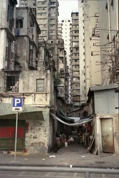 an alley way with lots of buildings in the background