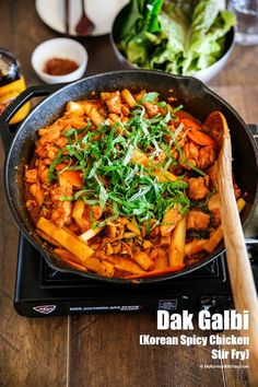 a pan filled with food sitting on top of a stove