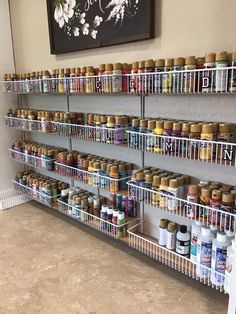 the shelves are full of spices and condiments