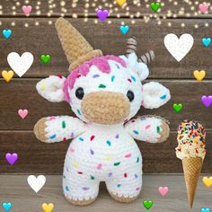 a crocheted stuffed animal next to an ice cream cone