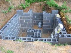 a cinder block structure with bricks in the middle