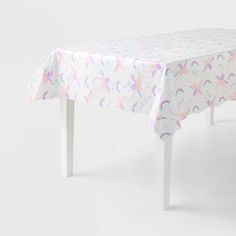 a white table with a pink and blue design on it