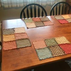 a wooden table topped with lots of place mats