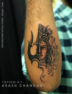 a man with a tattoo on his arm