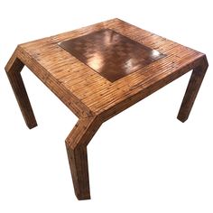 a table made out of bamboo with a square top