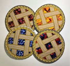 three pies with different designs on them sitting next to each other