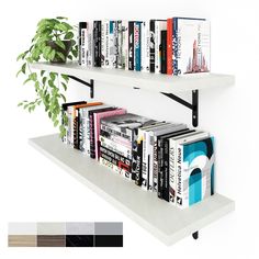 two white shelves with books and plants on them