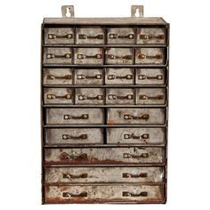 an old metal drawer with lots of drawers on the top and bottom, sitting against a white background