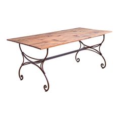 a wooden table with wrought iron legs on an isolated white background for use as a coffee table